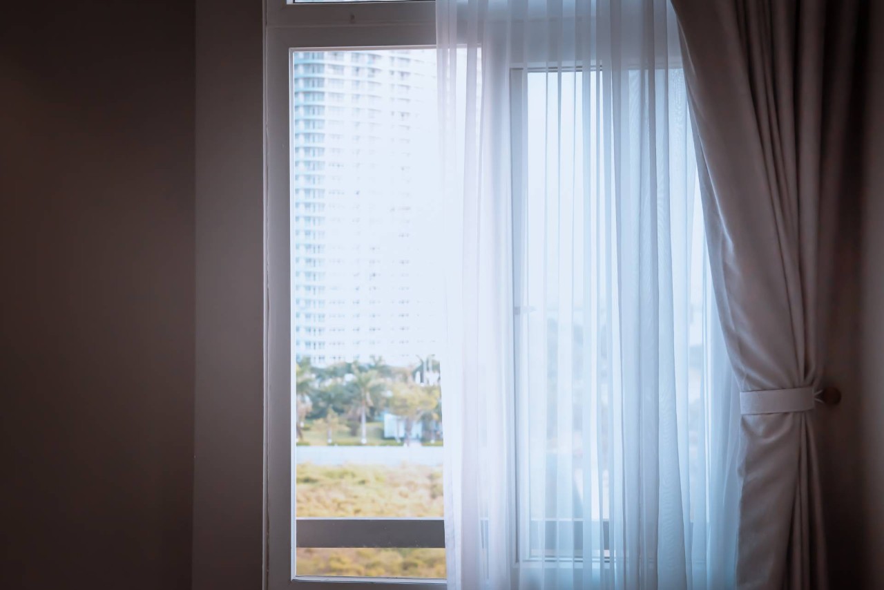 A window with a curtain and sheer shade at Discount Best Blinds & Shutters near Santa Rosa, California (CA)